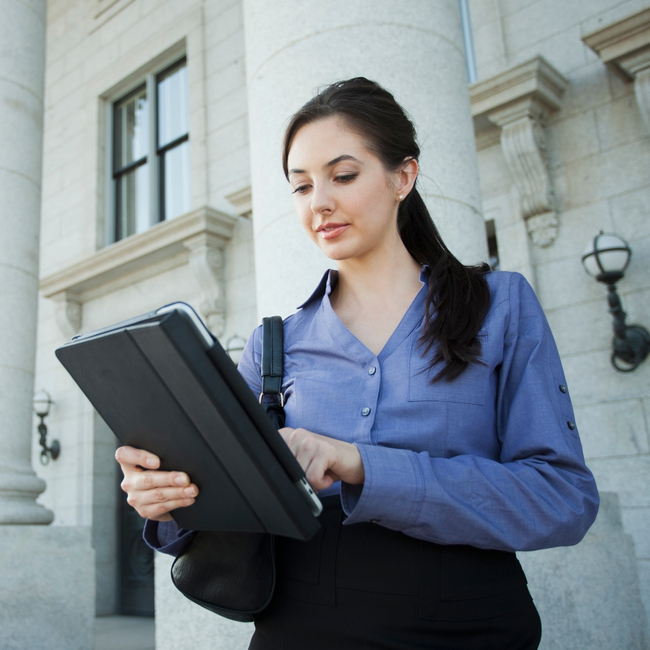 Caucasian Businesswoman Using Digital Tablet Outdoors