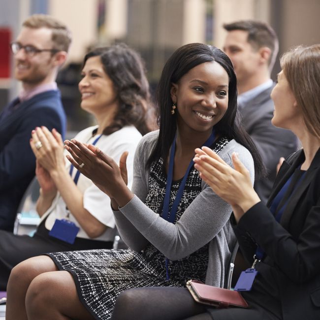 Audience,applauding,speaker,after,conference,presentation