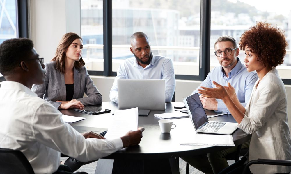 Millennial Black Businesswoman Addressing Colleagues At A Corporate Business Meeting, Close Up