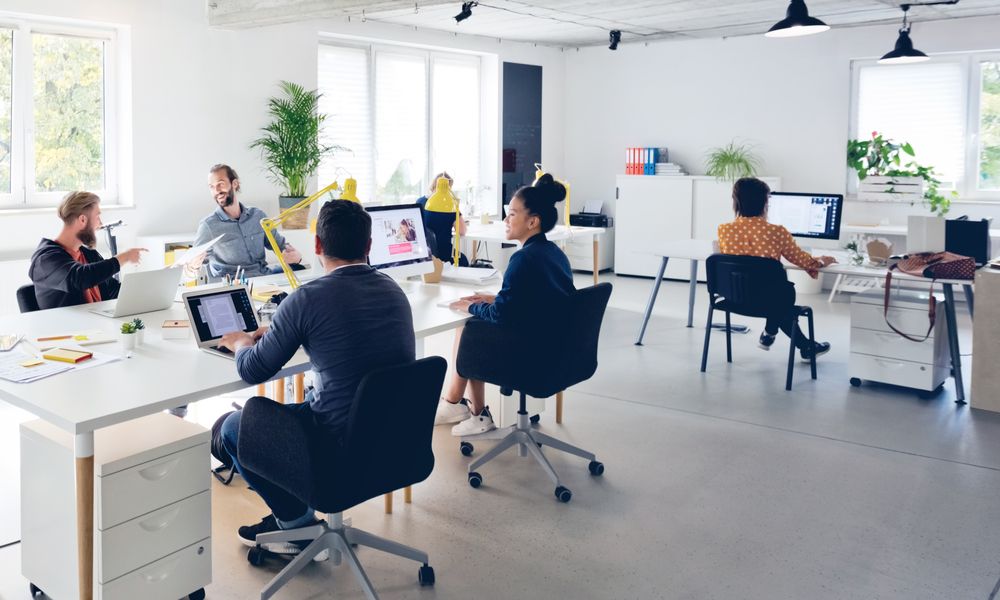 Business Professionals Working At New Office Desk