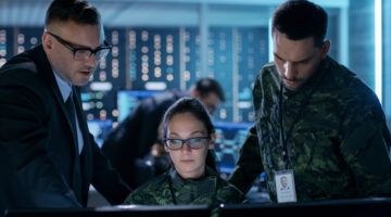 Government Surveillance Agency And Military Joint Operation. Male Agent, Female And Male Military Officers Working At System Control Center.