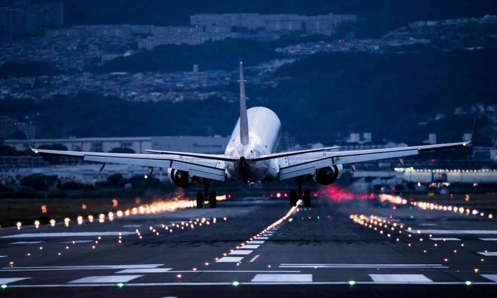 A Picture Of The Back Of The Arriving Airplane.